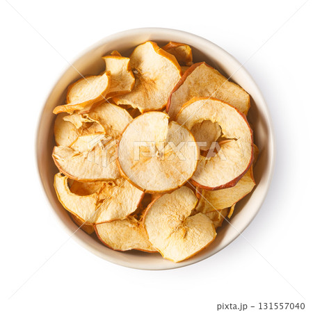Dried apple slices in bowl, healthy snack concept Dried apple slices in bowl, healthy snack concept 131557040