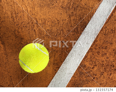 Freeze Motion Detail Shot of Tennis Ball Hitting a Clay Court Freeze Motion Detail Shot of Tennis Ball Hitting a Clay Court 131557174