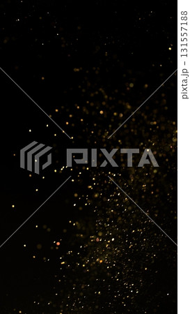 Freeze Motion Shot of Golden Glitter Background Isolated on Black 131557188
