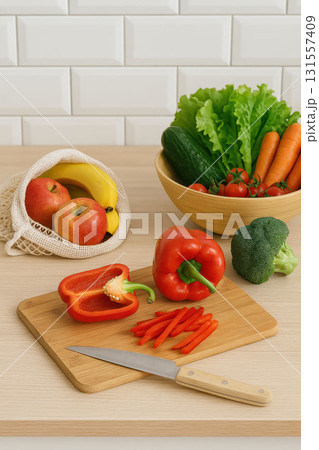 Fresh vegetables and fruits on kitchen table Fresh vegetables and fruits on kitchen table 131557409