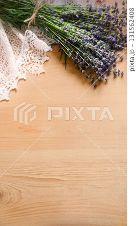 Lavender flowers lie on the table on lace 131562408
