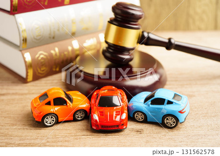 Bangkok, Thailand March 15, 2023 Car accident lawsuit and insurance, Judge hammer with car model. Bangkok, Thailand March 15, 2023 Car accident lawsuit and insurance, Judge hammer with car model. 131562578