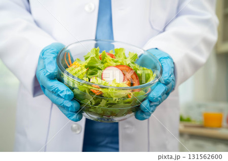 Asian Nutritionist holding healthy food for patient in hospital, nutrition and vitamin. 131562600