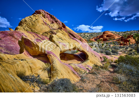 Neapolitan Colored Arch Formation and Desert Landscape in Bright Sunlight Neapolitan Colored Arch Formation and Desert Landscape in Bright Sunlight 131563083