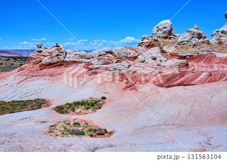 Swirling Sandstone Layers and Rock Pinnacles Under Blue Sky White Pocket Arizona Swirling Sandstone Layers and Rock Pinnacles Under Blue Sky White Pocket Arizona 131563104