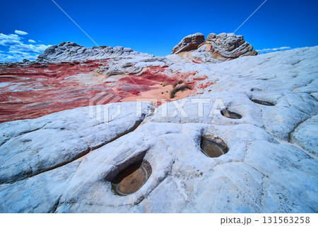 White Pocket sandstone formations with water pools and blue sky Arizona White Pocket sandstone formations with water pools and blue sky Arizona 131563258