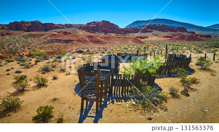 Aerial Old Wooden Corral and Red Rock Desert Landscape Nevada 131563376