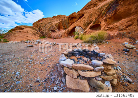 Stone Campfire Ring and Red Rock Caves in Nevada Desert Landscape 131563408