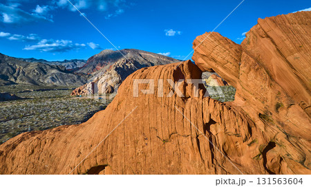 Aerial Red Sandstone Arch Formation and Desert Landscape Nevada 131563604