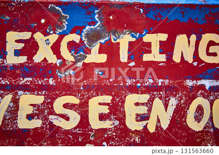 Distressed Metal Sign With Exciting Text And Bullet Holes Texture Detail Distressed Metal Sign With Exciting Text And Bullet Holes Texture Detail 131563660