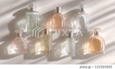Flat lay display features various perfume bottles highlighting unisex aromatic fragrances for self-care Flat lay display features various perfume bottles highlighting unisex aromatic fragrances for self-care 131565605