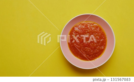 Tomato sauce red cream on bowl yellow background Tomato sauce red cream on bowl yellow background 131567083