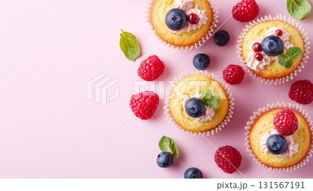 Sweet muffin cake cup with blueberry and raspberry fruit topping 131567191