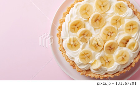 Banana cream pie crusty bread cake tart for family time on pink background 131567201