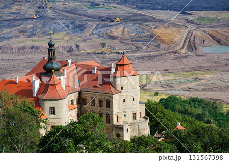 Jezeri Castle with Czechoslovak army coal mine in background, Horni Jiretin, Most district, Ustecky region, Czech Republic, sunny summer day Jezeri Castle with Czechoslovak army coal mine in background, Horni Jiretin, Most district, Ustecky region, Czech Republic, sunny summer day 131567398