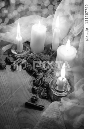 Candles and dried rosebuds on the table 131567749