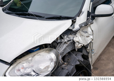 Severe front-end collision damage on compact car with internal structure exposed - automotive claim and digital repair assessment concept Severe front-end collision damage on compact car with internal structure exposed - automotive claim and digital repair assessment concept 131569354