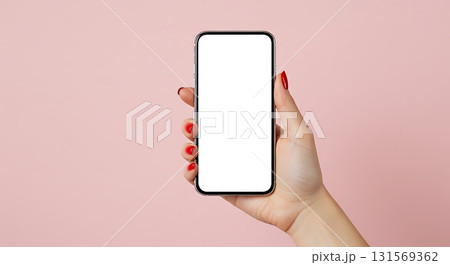 Elegant hand with bright red nails showcases a sleek modern smartphone with a blank white screen, perfect for app promotion or digital content. 131569362