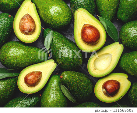 Rotating segment of a ripe and juicy avocado on an orange background. Rotating segment of a ripe and juicy avocado on an orange background. 131569508