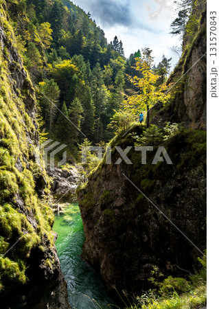 Hiking Woman On Spectacular Trail Triftsteig Through Canyon Tiefenbachklamm With Brandenburger Ache In Tyrol, Austria Hiking Woman On Spectacular Trail Triftsteig Through Canyon Tiefenbachklamm With Brandenburger Ache In Tyrol, Austria 131570843