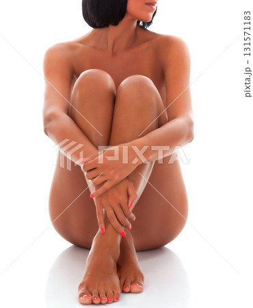 Sexy naked woman sitting on white floor, isolated on white background 131571183
