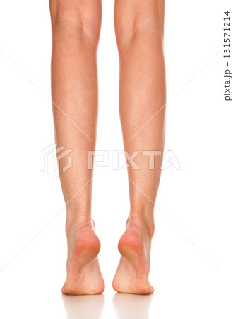 Closeup shot of female bare feet, isolated on white background Closeup shot of female bare feet, isolated on white background 131571214