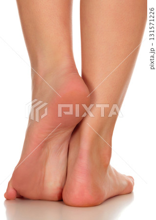 Closeup shot of female feet, isolated on white background 131571226