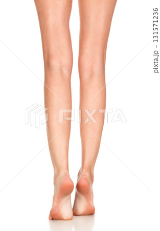 Closeup shot of female bare feet, isolated on white background Closeup shot of female bare feet, isolated on white background 131571236