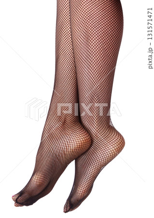 Beautiful long woman's legs in black net pantyhose, isolated Beautiful long woman's legs in black net pantyhose, isolated 131571471