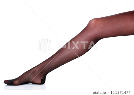 Female leg in black stockings, isolated on white background 131571474