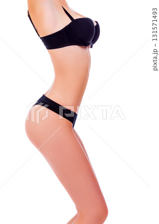 Sexy gorgeous woman with lovely slim body and big breasts posing against white background, isolated 131571493