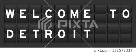 Black color analog flip board with word welcome to detroit on gray background 131572337