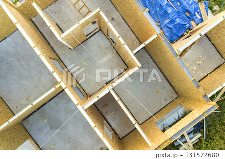 Construction of new and modern modular house. Walls made from composite wooden sip panels with styrofoam insulation inside. Building new frame of energy efficient home concept. 131572680