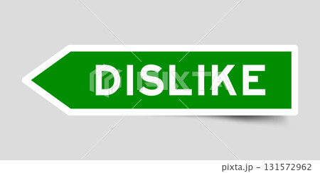 Green color arrow shape sticker label with word dislike on gray background 131572962