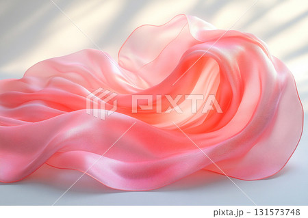 Showcasing luxury fabrics. Pastel colored silk scarf on white background. Soft and flowing waves. 131573748