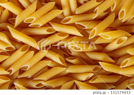 Golden Yellow Penne Pasta Tubes with Wheat Durum Top View Golden Yellow Penne Pasta Tubes with Wheat Durum Top View 131574933