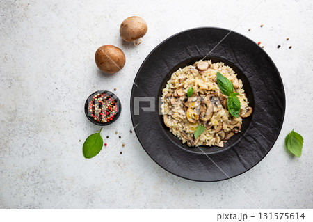 Risotto with mushrooms in a plate 131575614