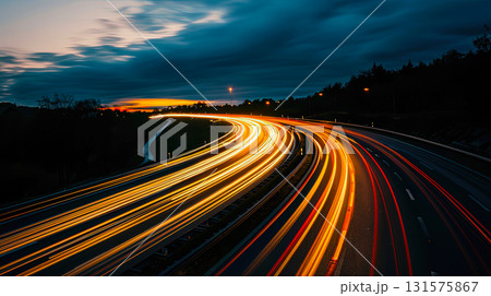 light trails on highway at night, long exposure city traffic 131575867