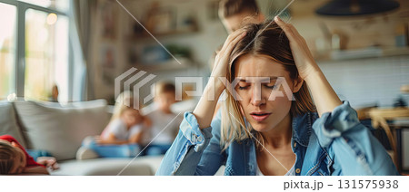 Stressed mother at home with children Stressed mother at home with children 131575938