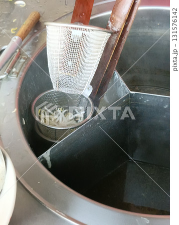 Stainless steel noodle strainer metal wire mesh wooden handles cooking pot bean sprout boiling water kitchen utensil food preparation 131576142