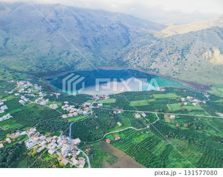 Scenic Lake Kournas in Crete on sunny day aerial view. Scenic Lake Kournas in Crete on sunny day aerial view. 131577080