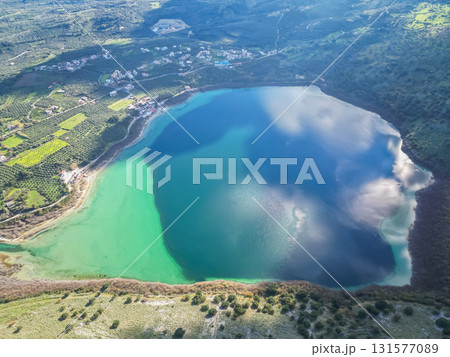 Scenic Lake Kournas in Crete on sunny day aerial view. Scenic Lake Kournas in Crete on sunny day aerial view. 131577089