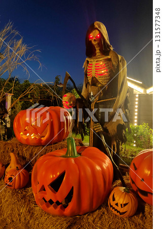 Grim reaper and Jack O'lanterns during Halloween 131577348