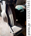 Grinding Wheel Attached to a Machine in a Workshop During Daylight Hours 131577845
