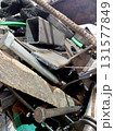 Scrap Metal Piled High in a Recycling Yard Showing Various Materials During the Late Afternoon 131577849