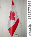 Canadian Flag Displayed Indoors During a Gathering to Celebrate National Pride and Unity 131577865