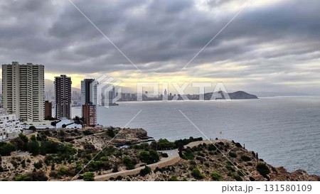 Explore a hilltop coastal city with ocean views and scenic cliffs 131580109