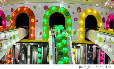 Experience the thrilling vibe of an illuminated amusement park Experience the thrilling vibe of an illuminated amusement park 131580188