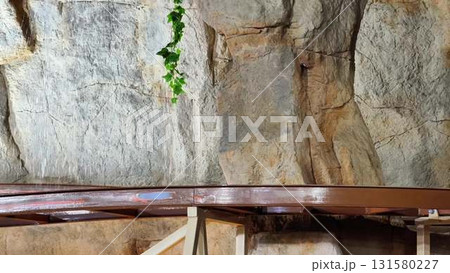 This stunning and breathtaking cave rock formation is beautifully complemented by lush greenery 131580227