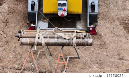 Heavy Construction Equipment with Pipe Support at a Job Site for Various Tasks and Needs 131580254